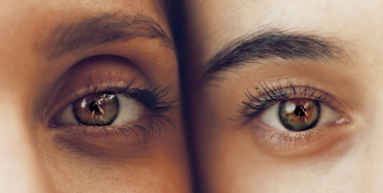 eyes of two people up close