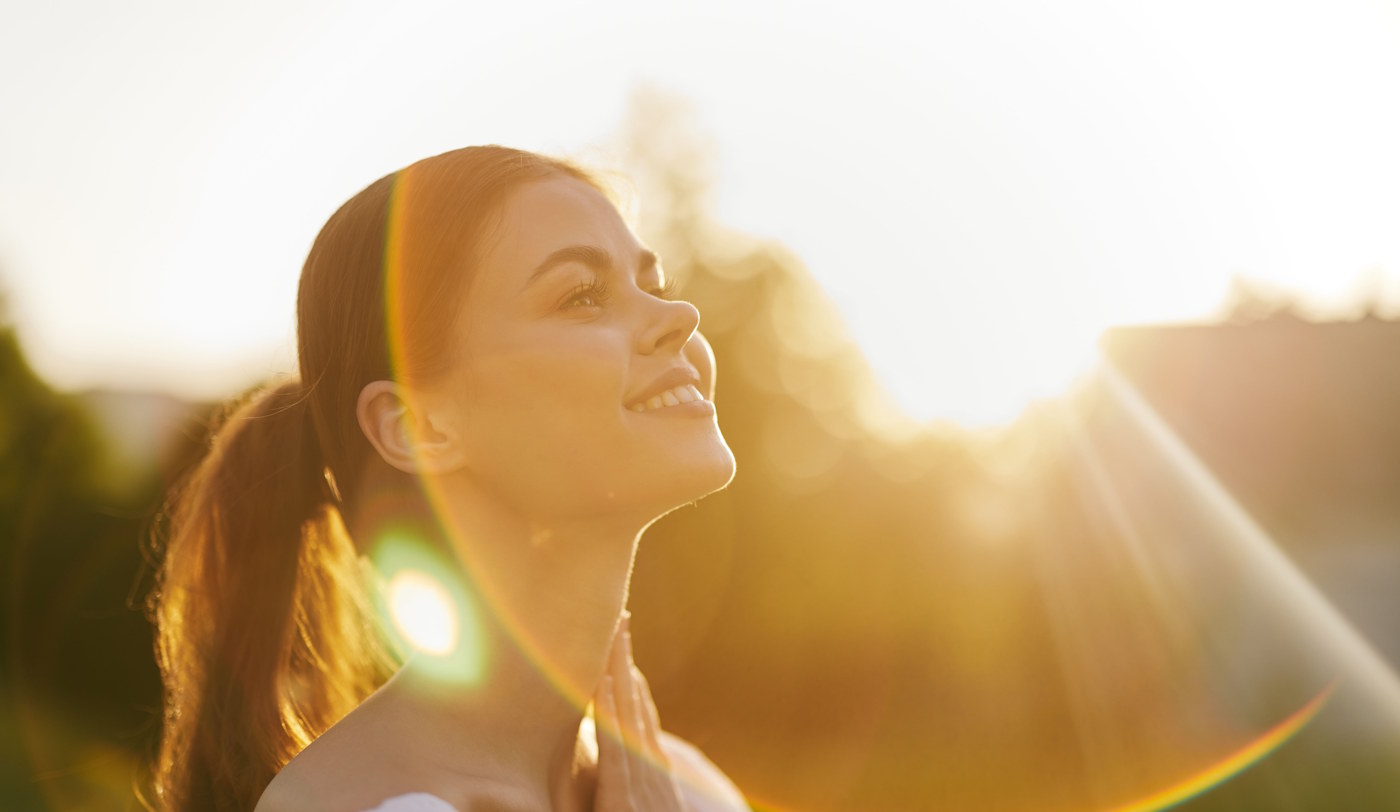 woman smiling in the sun